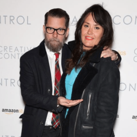 Gavin hugging his spouse, Emily Jendrisak while attending an event together.